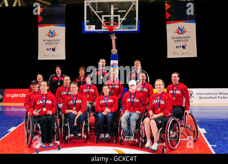 Paralympics - BT Paralympic World Cup 2010 - Day Six - Manchester. Canada pose for a photo after the Wheelchair Basketball match during the BT Paralympic World Cup at Sport City, Manchester. Stock Photo