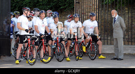 Prince Michael of Kent sees off former British Formula One World champion Nigel Mansell (front second left), as he sets off with his sons Greg (centre left, holding Nigel Mansell's grandson, by daughter Chloe, Jai, 18 months) and Leo (third right) on the Nigel Mansell UK Youth Cycle Challenge, to raise awareness of the Positive About Youth Campaign and to raise 1 million for UK Youth. At Kensington Palace, London.