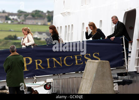 (left to right) Autumn Phillips, Princess Eugenie, Princess Beatrice and the Duke of York as they disembark from the Hebridean Princess boat after a family holiday around the Western Isles of Scotland with Queen Elizabeth II. Stock Photo