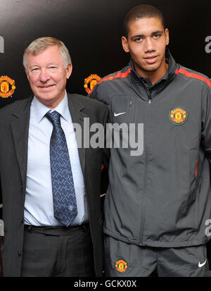 Soccer - Manchester United Press Conference - Old Trafford. Manchester United manager Sir Alex Ferguson with new signing Chris Smalling during a press call at Old Trafford, Manchester. Stock Photo