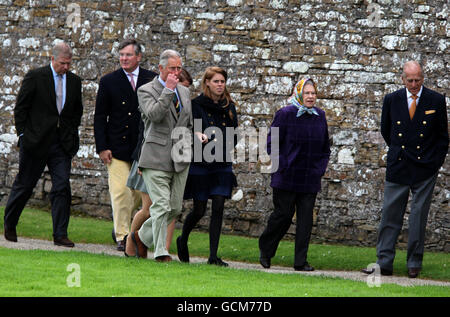 Queen Elizabeth II (second right), accompanied by the Duke of Edinburgh (r), the Duke of York (left), the Prince of Wales (third left), Princess Beatrice (third right) during a visit to the visitors centre at the Castle of Mey, in Scotland. Stock Photo