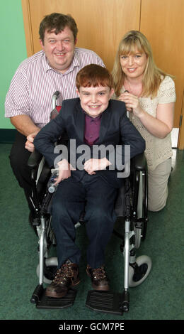 Ciaran Finn-Lynch, aged 11, who is the recipient of the world's first child stem cell supported tracheal transplant, with his parents, Colleen and Paul (surnames not given) at Great Ormond Street Hospital, London. Stock Photo