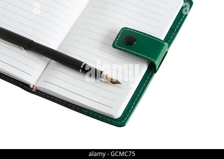Closeup of fountain pen on green leather notebook Stock Photo