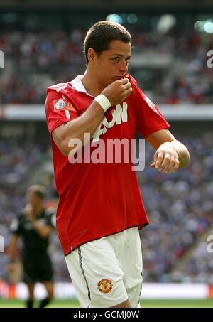 Manchester United's Javier Hernandez kisses the club badge on his shirt after scoring his sides second goal of the game