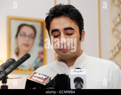 Bilawal Bhutto Zadari, the son of President Zadari of Pakistan and his wife the late Benazir Bhutto, Pakistan's former President (pictured rear) launching an appeal for flood victims of Pakistan at the Pakistan High Commission to the UK in London this morning. Stock Photo