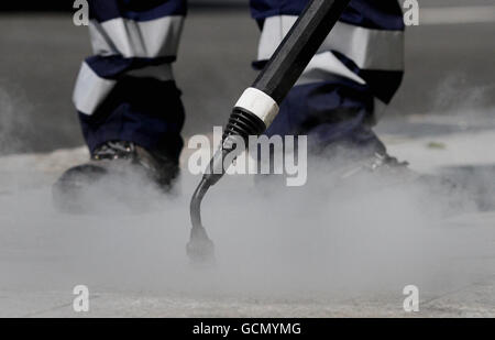 A Brighton & Hove council worker uses a new clean, capture and recycling machine in Brighton, East Sussex, which is designed to clear up 100,000 pieces of gum a day from the city's streets while only using 3 percent of the water used by other gum busting machines. Stock Photo