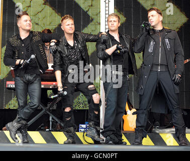 Westlife (from left to right) Shane Filan, Nick Byrne, Kian Egan and Mark Feehily perform on stage during Ladies Day at Newbury Races, Berkshire today. Stock Photo