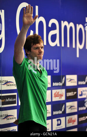 Stockport Metro's Michael Rock celebrates with his Gold medal for the Men's Open 100m Butterfly during the British Swimming Championships at Ponds Forge, Sheffie Stock Photo