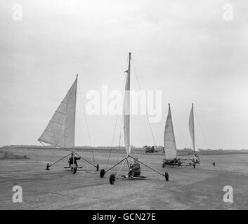 With the grace and beauty of their marine counterparts, and at speeds of up to 50 m.p.h. four land yachts race down the runway at Great Gransden. Stock Photo