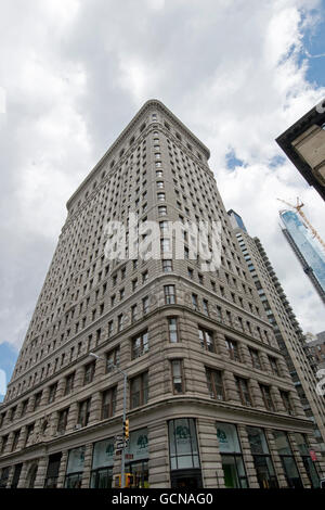 An unusual view of the Flatiron building from Fifth Avenue and 22nd Street. In New York City. Stock Photo