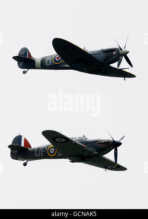 A Mk VB Spitfire (top) and a Mk 1 Hurricane fly past Biggin Hill Airport in Kent to mark the 70th anniversary of Winston Churchill's tribute to 'The Few' in August 1940. Stock Photo