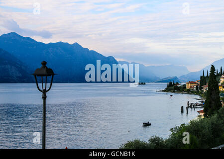 Wake up at Lago di Garda, Italy before a kitesurfing session.   Notice how calm the lake is before the wind comes in. Stock Photo