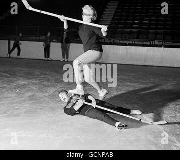 Brenda Whaley, 19, jumps over the fallen Jackie Hay, 16, during practice. Stock Photo