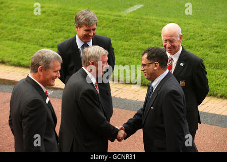 Manchester United's manager Sir Alex Ferguson (centre) greets the FIFA inspection team led by FIFA's Chilean Federation President Harold Mayne-Nicholls (second left) as Sir Bobby Charlton (right) and Manchester United Chief Executive David Gill (left) watch on during FIFA's 2018 World Cup Bid Inspection at Old Trafford, Manchester. Stock Photo