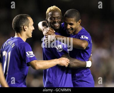 Everton's Louis Saha (centre) celebrates with team mates Leon Osman (left) and Jermaine Beckford after scoring his side's fourth goal of the game Stock Photo