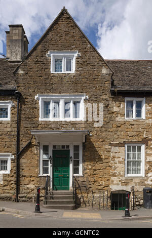 A 17th-century historic vernacular stone house with mullioned windows on the High Street, Wotton-under-Edge, Gloucestershire. Stock Photo