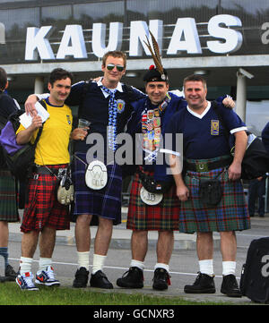 Scotland football fans wait for a taxi outside Kaunas Airport ahead of the UEFA European Championship Qualifing match at the Darius Girenas Stadium, Kaunas. Stock Photo