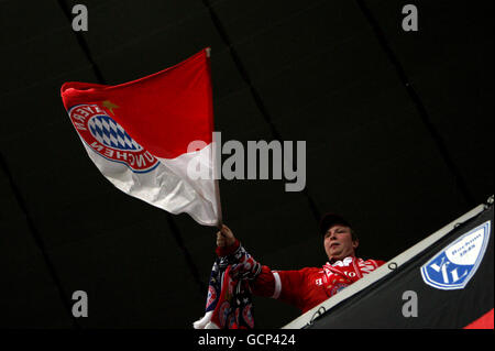 Soccer - UEFA Champions League - Group E - Bayern Munich v AS Roma - Allianz Arena. A Bayern Munich fan waves a flag in the stands. Stock Photo