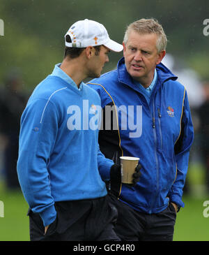 European Captain Colin Montgomerie (right) speaks with Martin Kaymer during a practice round at Celtic Manor, Newport. Stock Photo