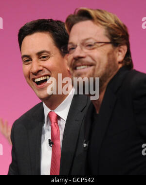 Labour Party leader Ed Miliband and comedian Eddie Izzard during a Q & A session at Manchester Central during the fourth day of the Labour Party Conference in Manchester. Stock Photo