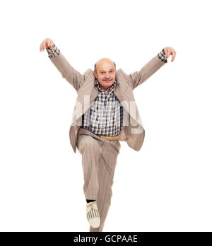 Elderly man fooling around, making the position of kung fu. Stock Photo
