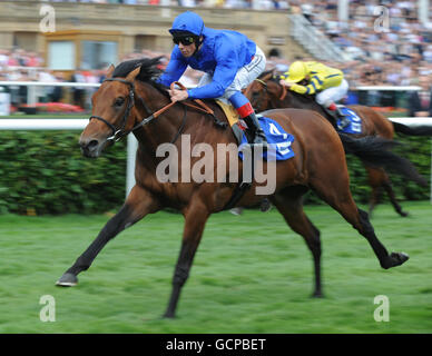 Horse Racing - Ladbrokes St Leger Day - Doncaster Racecourse. Saamid ridden by Frankie Dettori wins the Neptune Investment Management Champagne Stakes on Ladbrokes St. Leger Day at Doncaster Racecourse. Stock Photo