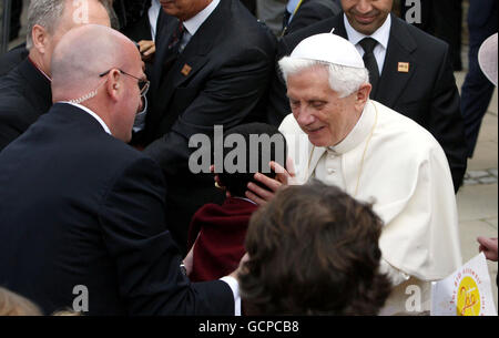 Pope Benedict XVI kisses the head of Adam (no surname given), aged 5, as he arrives for a celebration of Catholic education at St Mary's University College in Twickenham, South West London. Stock Photo