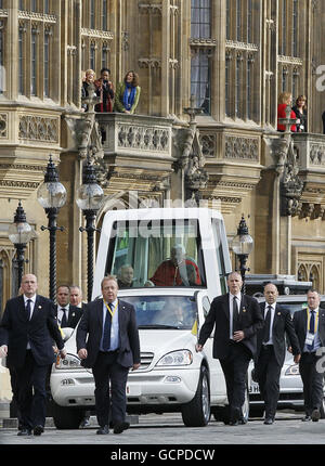 Pope Benedict XVI arrives by his 'Popemobile' at the St Stephens entrance of the Houses of Parliament in London on his way to the Westminster Hall to deliver a speech the second day of his State Visit. Stock Photo