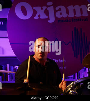 The Charlatans, with temporary drummer Pete Salisbury of The Verve, performing during Oxjam - a month long festival that sees over 600 music events taking place across the UK - at Oxfam in Dalston, east London. Stock Photo