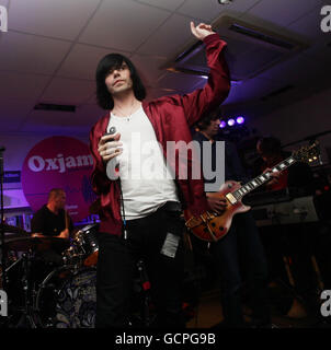 The Charlatans performing during Oxjam - a month long festival that sees over 600 music events taking place across the UK - at Oxfam in Dalston, east London. Stock Photo