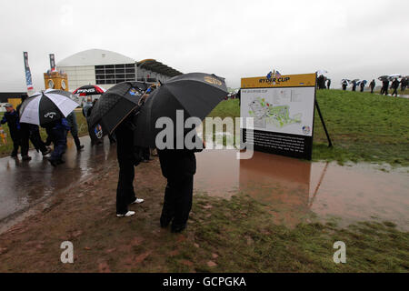 Crowd walk around the tented village as play is suspended on the opening morning during the Ryder Cup at Celtic Manor, Newport. Stock Photo
