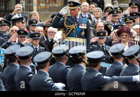 Prince Charles salutes while watching a parade during the National Commemorative Service for the 70th anniversary of Battle of Britain at Westminster Abbey. Stock Photo