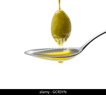 Green olive on stalk with full oil spoon, isolated Stock Photo