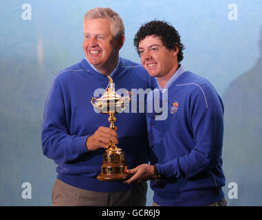 Golf - 38th Ryder Cup - Europe v USA - Practice Day Two - Celtic Manor Resort. Europe captain Colin Montgomerie (left) and Rory McIlory pose for a picture with the Ryder Cup during a photocall at Celtic Manor, Newport. Stock Photo