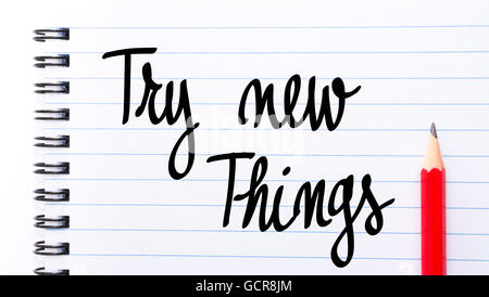 Try New Things written on notebook page with red pencil on the right Stock Photo