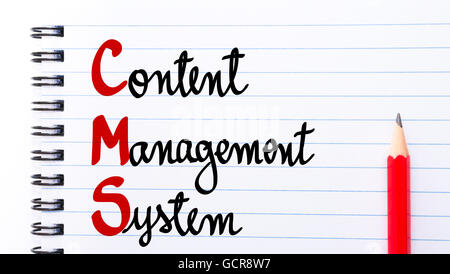 CMS Content Management System written on notebook page with red pencil on the right Stock Photo