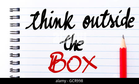Think Outside The Box written on notebook page with red pencil on the right Stock Photo