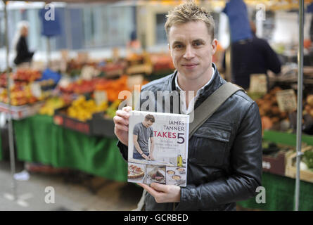 Celebrity Chef James Tanner with his new book 'James Tanner Takes 5' at London's Tachbrook Street market. Stock Photo