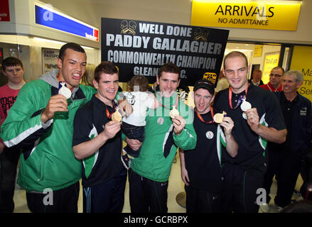 Boxers,Tommy McCarthy, Paddy Gallagher, Eamonn O'Kane, Paddy Barnes and Steven Ward (left to right) with their Commonwealth medals at George Best Belfast City Airport, Belfast, Northern Ireland. Stock Photo