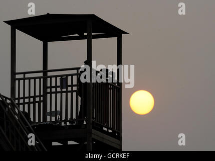 Sport - 2010 Commonwealth Games - Day Four - Delhi. Security keep guard as the sun sets near the Jawaharlal Nehru Stadium during Day Four of the 2010 Commonwealth Games in New Delhi, India. Stock Photo