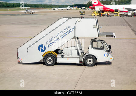 Airport steps vehicle at Nuremburg Airport Stock Photo