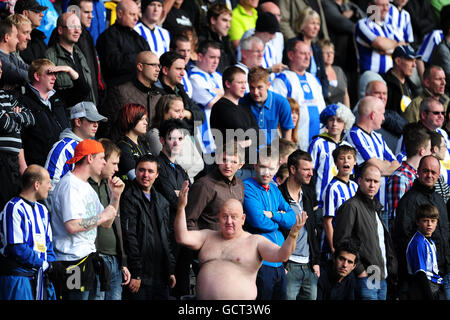Soccer - npower Football League One - Notts County v Sheffield Wednesday - Meadow Lane. Sheffield Wednesday fan Paul Gregory, also known as Tango Man, (centre) shows his support in the stands Stock Photo