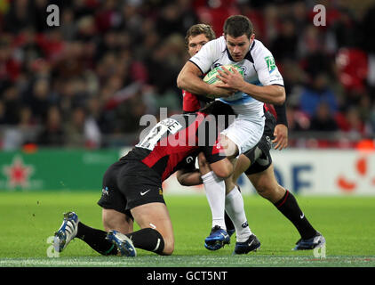 Rugby Union - Heineken Cup - Pool 2 - Saracens v Leinster - Wembley. Leinster's Fergus McFadden is tackled by Brad Barritt of Saracens during the Heineken Cup Pool 2 match at Wembley Stadium, London.
