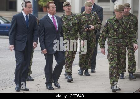 Prime Minister David Cameron and Governor of California Arnold Schwarzenegger during a visit to Wellington Barracks in central London. Stock Photo