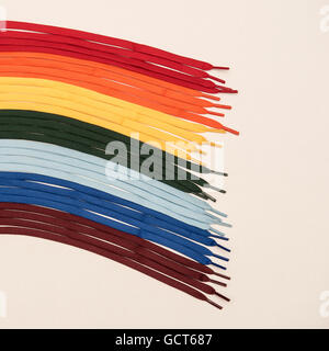 Rainbow coloured laces on a white background Stock Photo