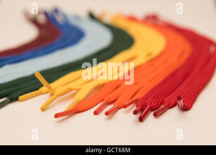 Rainbow coloured laces on a white background Stock Photo