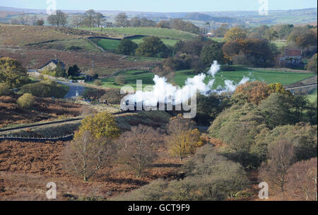 The steam engine 60007 'Sir Nigel Gresley' makes its way through the autumnal trees along the North Yorkshire Moors Railway near Goathland after several months of repair. Stock Photo