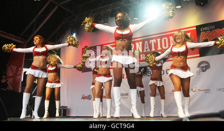 The San Francisco 49ers cheerleaders The Gold Rush perform during London's first ever NFL fan rally in Trafalgar Square, central London, ahead of the NFL game between the San Francisco 49ers and the Denver Broncos tomorrow at Wembley Stadium. Stock Photo