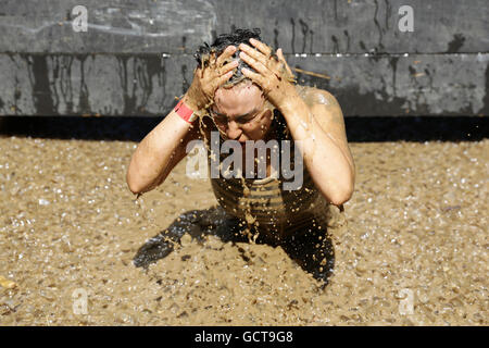 Sofia, Bulgaria - July 9, 2016: A participant is diving in an iced water at the Legion Run extreme sport challenge near Sofia. T Stock Photo