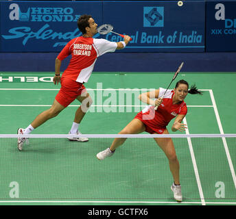 England's Nathan Robertson and Jenny Wallwork in action against Malaysia's Kien Koo nad Ee Chin in the mixed doubles final of the badminton competition on day eleven of the 2010 Commonwealth Games at the Siri Fort Sports Complex in Delhi, India Stock Photo